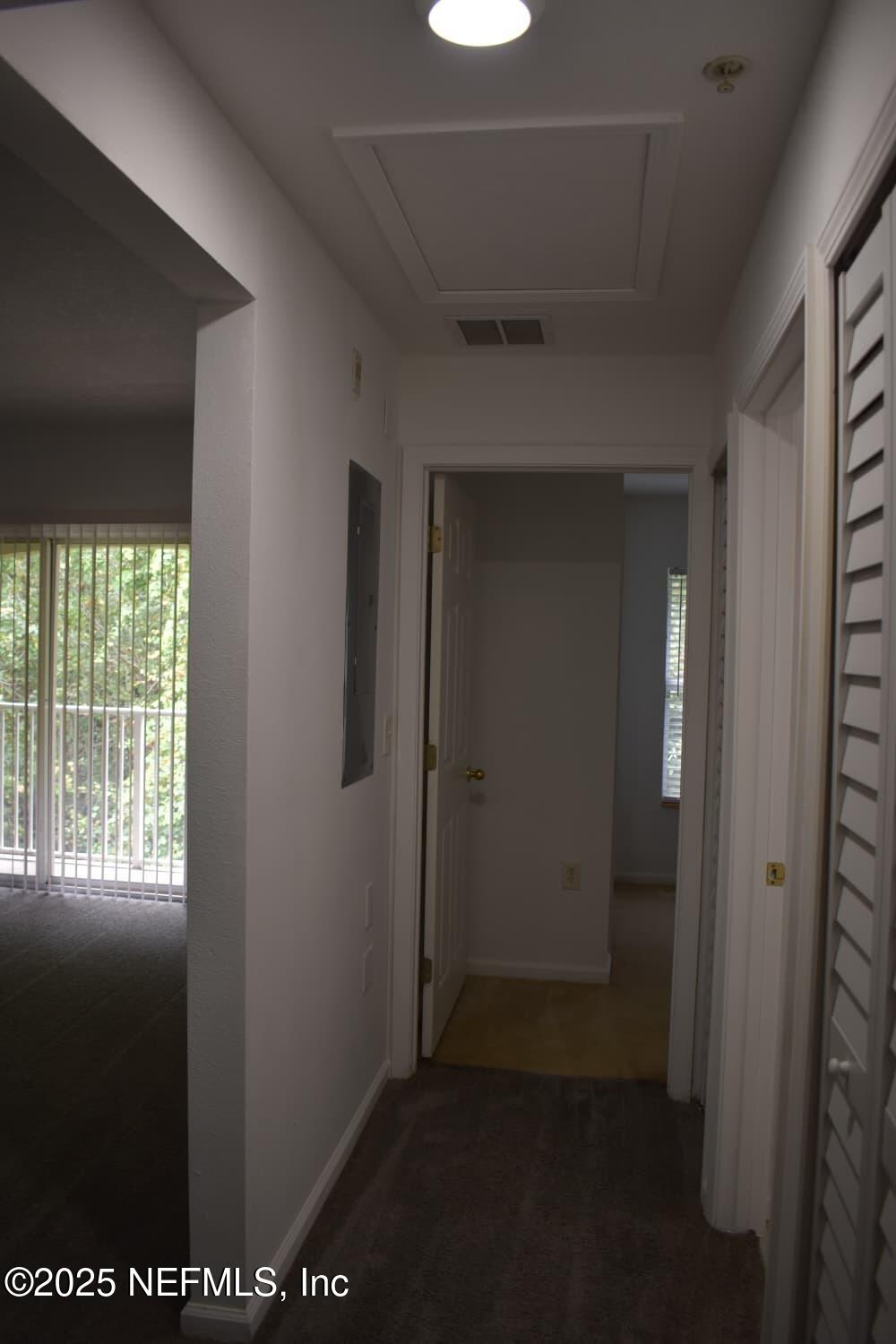 7920 Merrill Road, Unit 1710 Jacksonville, FL 32277 - Photo 36 of 51 a view of hallway with window