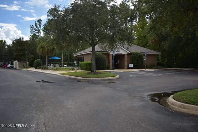 a view of a lake with chairs