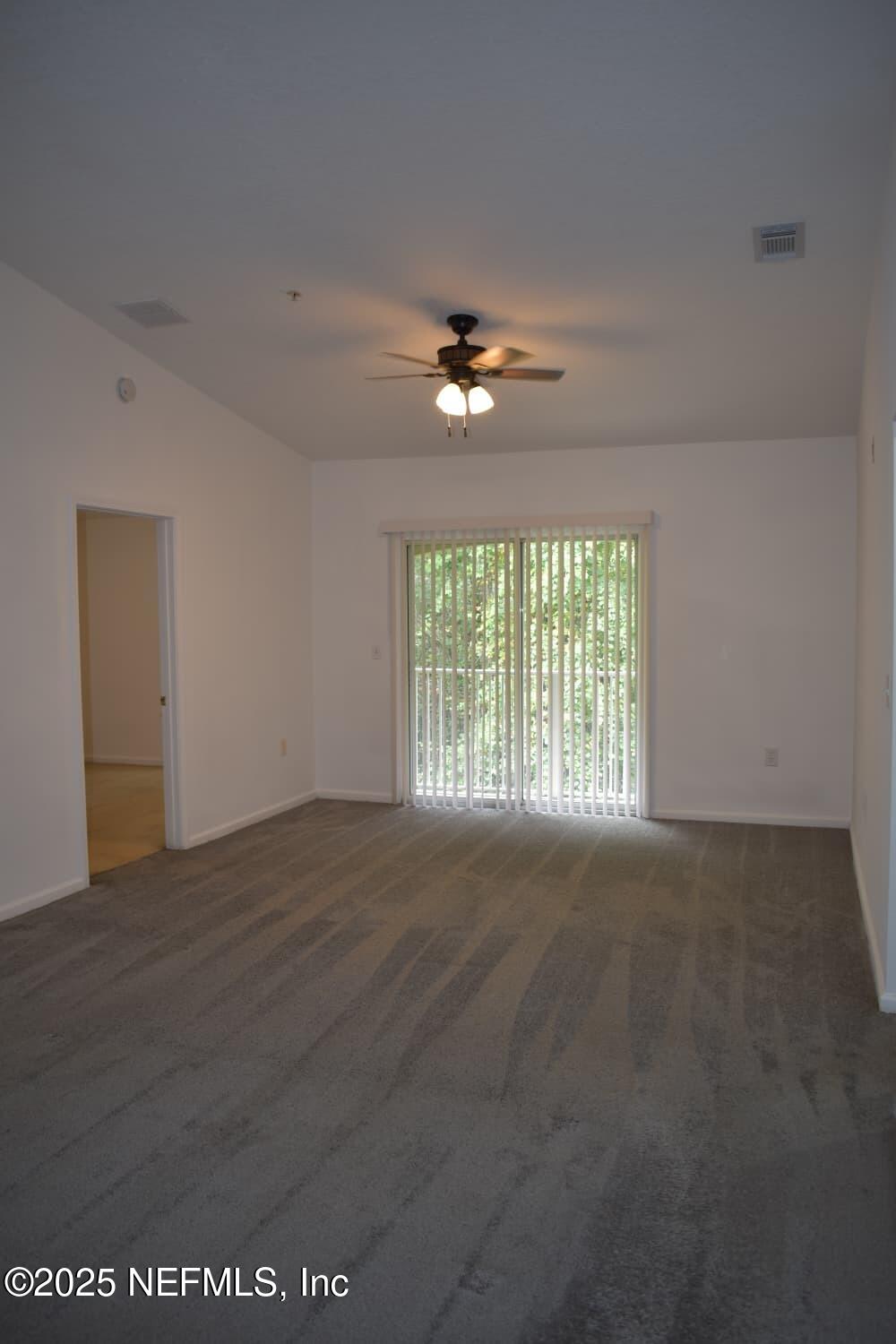 7920 Merrill Road, Unit 1710 Jacksonville, FL 32277 - Photo 5 of 51 a view of an empty room with a window