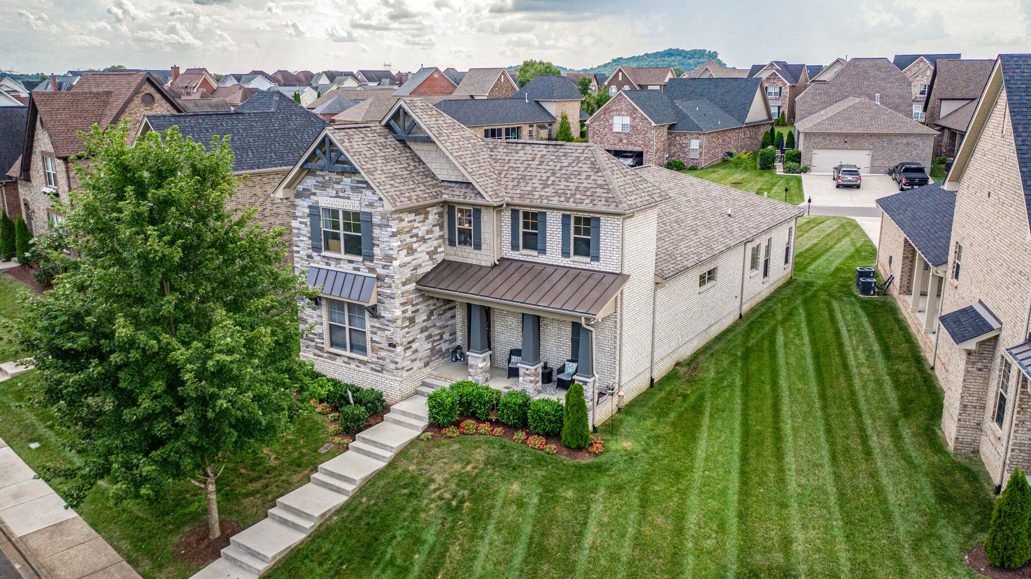 1072 Lt Gibson Circle Gallatin, TN 37066 - Photo 1 of 33 a aerial view of a house with a big yard plants and large trees