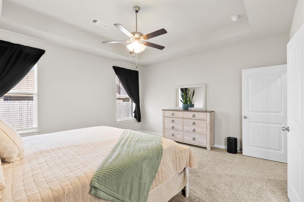 3306 Greymoore Drive Anna, TX 75409 - Photo 17 of 32 Comfortable primary suite with natural light and a large walk-in closet