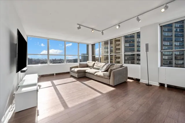 a living room with furniture and a flat screen tv