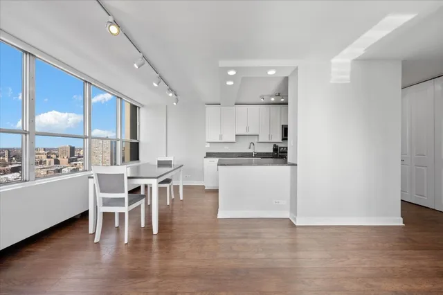 a kitchen with a table and chairs in it