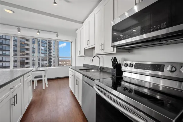 a kitchen with a stove and a sink
