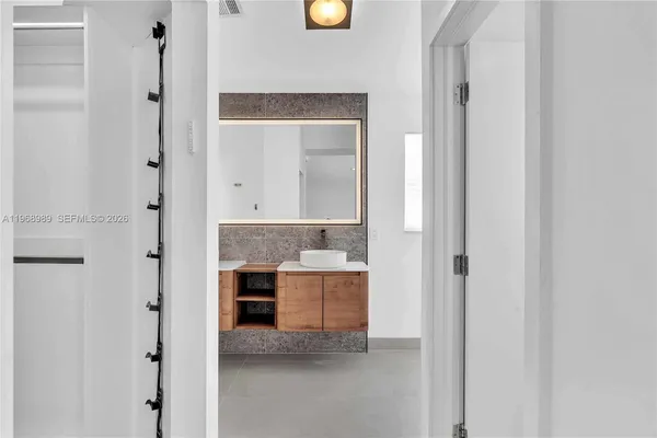 a view of kitchen and hall with wooden floor