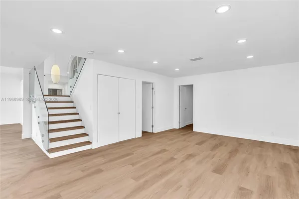 a view of entryway with wooden floor