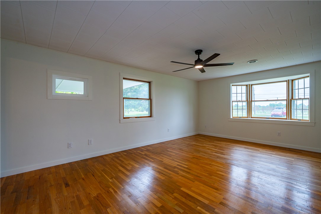 11296 Pansing Road Brookville, OH 45309 - Photo 5 of 53 This airy room features rich hardwood flooring and abundant natural light from multiple windows.
