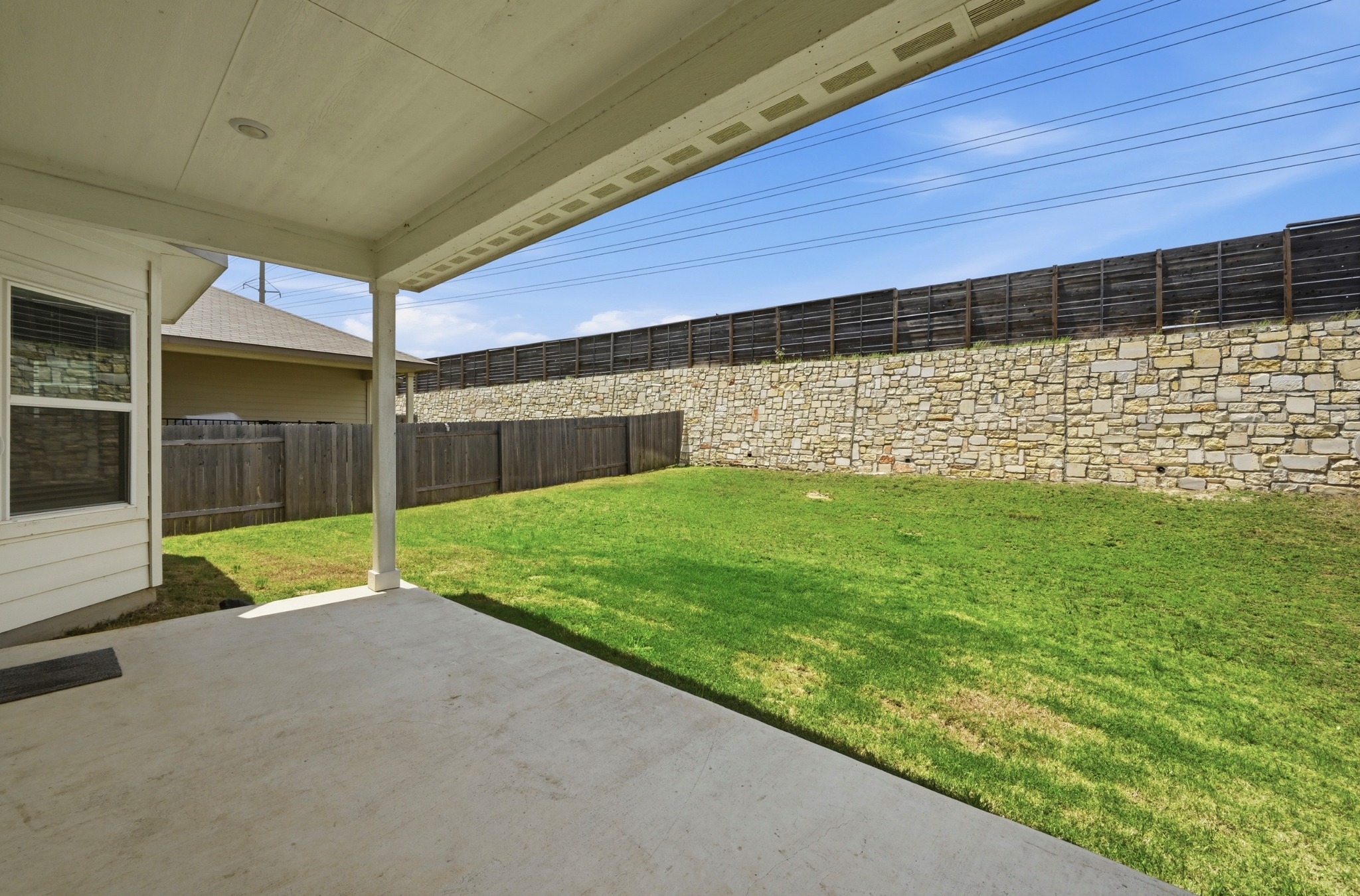 12606 Dairywork Road Buda, TX 78610 - Photo 29 of 32 It’s right off the main living area, so it’s easy to pop back and forth when you’re grilling