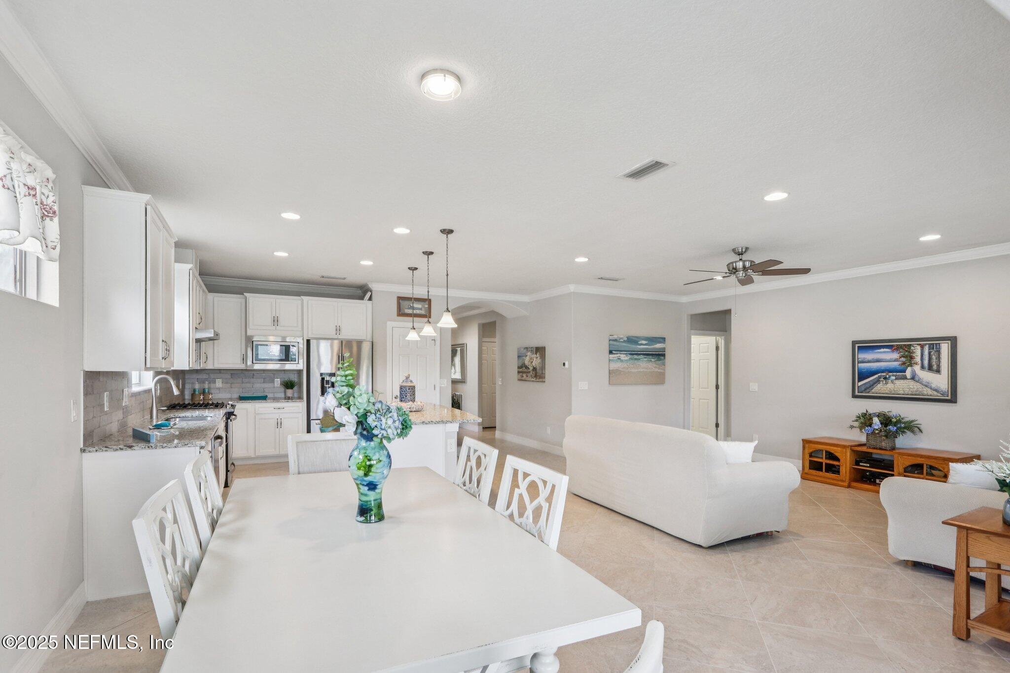 112 Bridge Oak Lane St. Augustine, FL 32095 - Photo 15 of 47 a living room with furniture and a table
