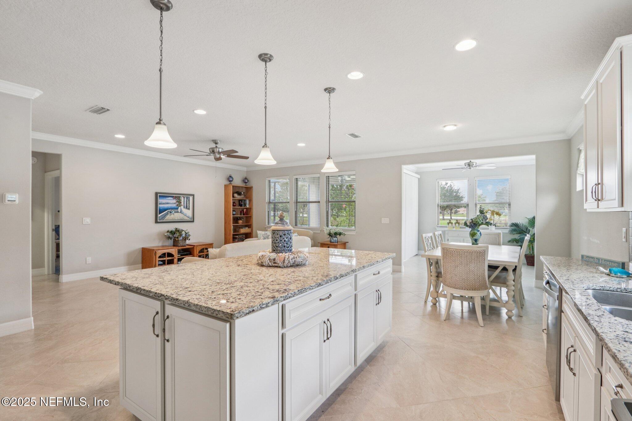 112 Bridge Oak Lane St. Augustine, FL 32095 - Photo 20 of 47 a kitchen with center island table and chairs