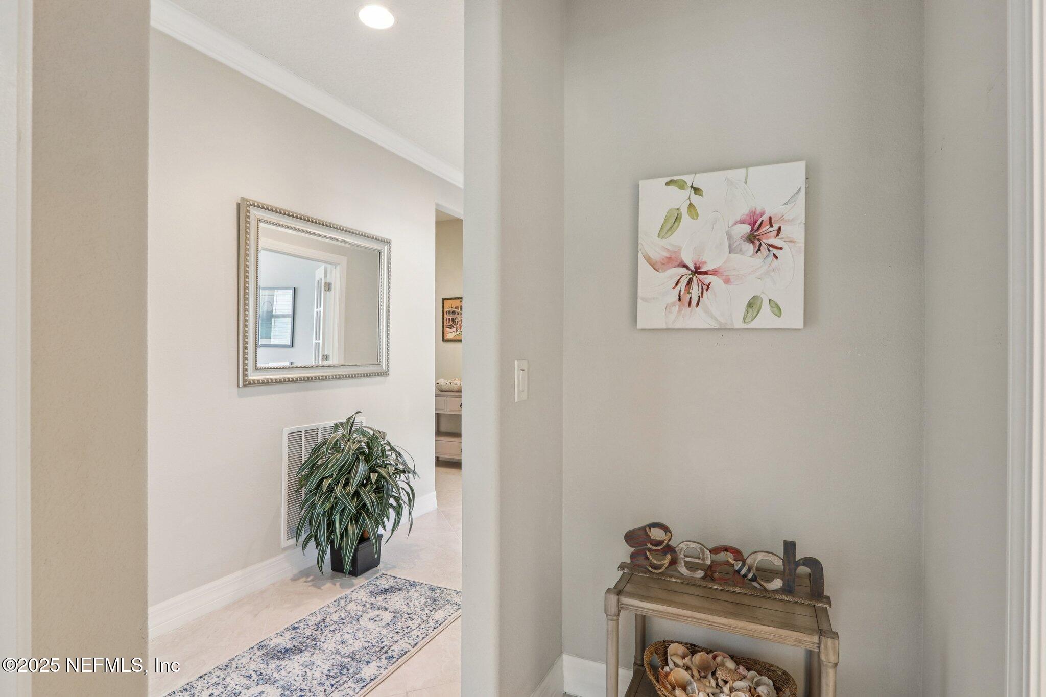 112 Bridge Oak Lane St. Augustine, FL 32095 - Photo 27 of 47 a view of a hallway with paintings on the wall