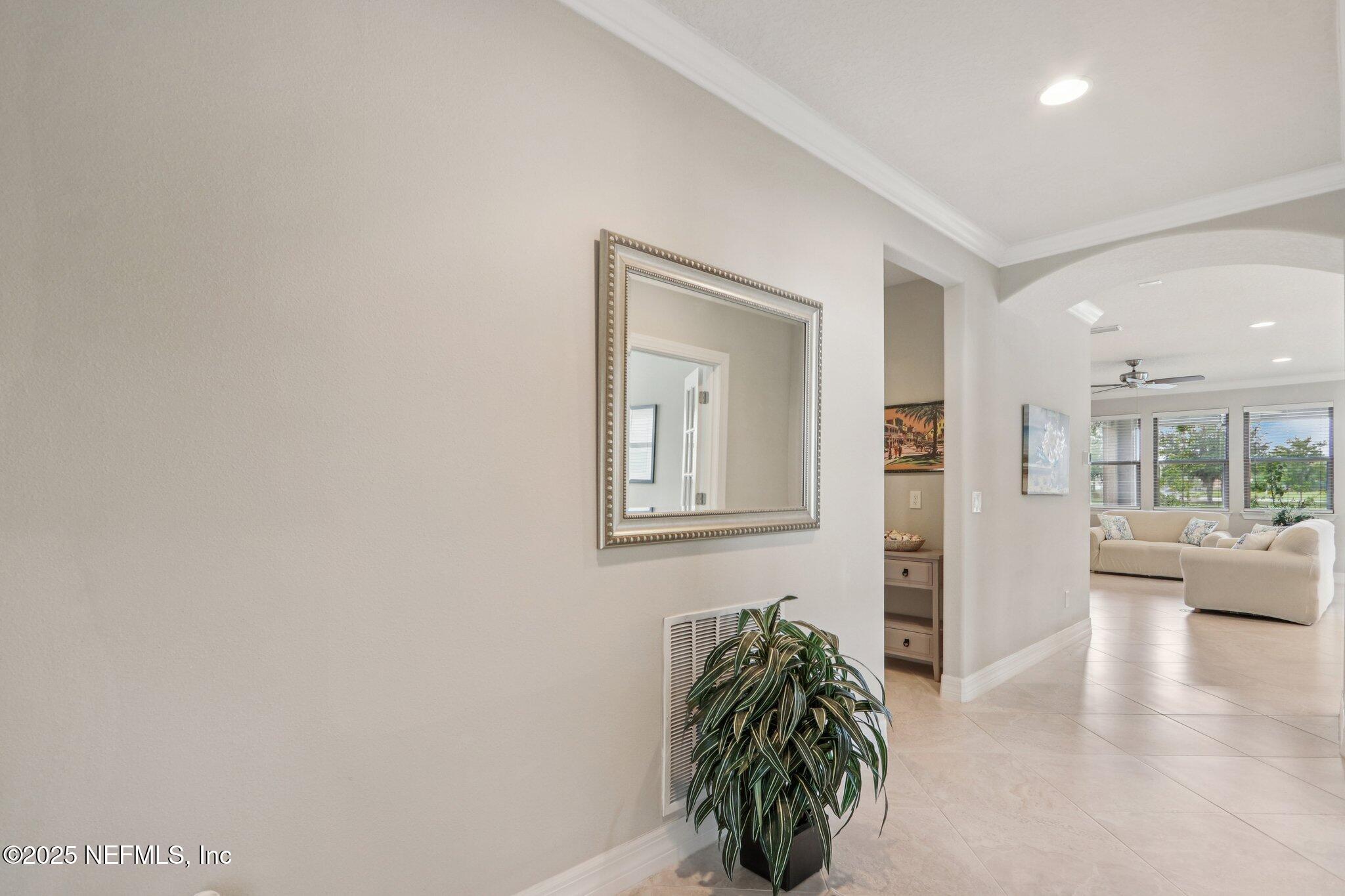 112 Bridge Oak Lane St. Augustine, FL 32095 - Photo 28 of 47 a room with furniture and a potted plant