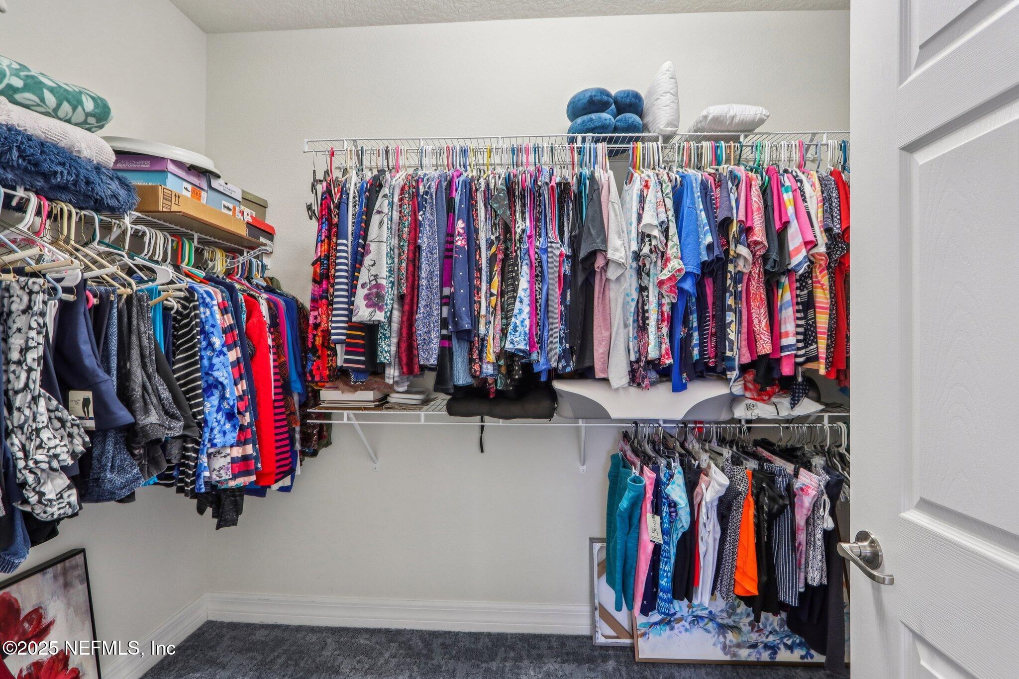 112 Bridge Oak Lane St. Augustine, FL 32095 - Photo 32 of 47 a view of walk in closet with clothes