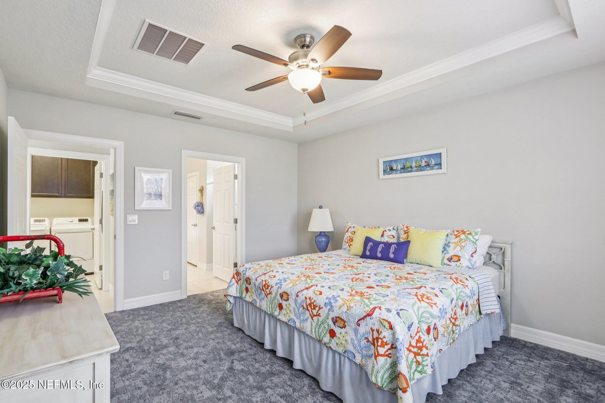 112 Bridge Oak Lane St. Augustine, FL 32095 - Photo 35 of 47 a bedroom with a bed and ceiling fan