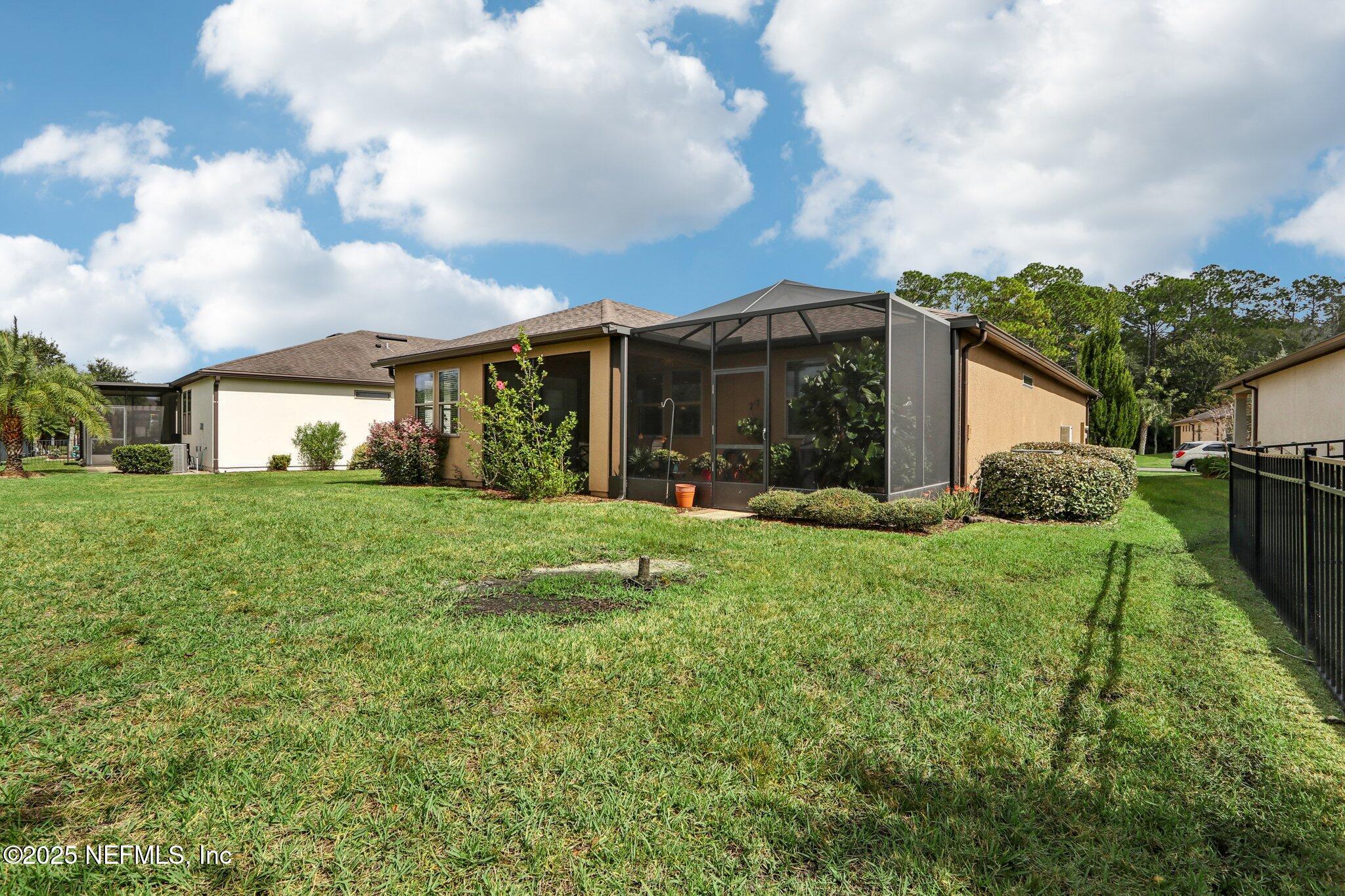112 Bridge Oak Lane St. Augustine, FL 32095 - Photo 41 of 47 a front view of house with yard and green space