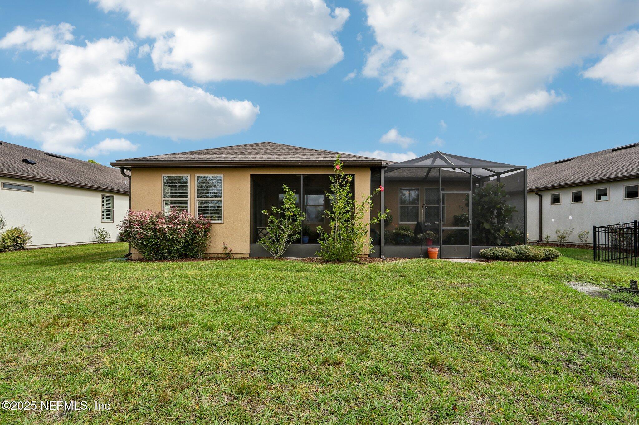 112 Bridge Oak Lane St. Augustine, FL 32095 - Photo 42 of 47 a view of a house with backyard and garden