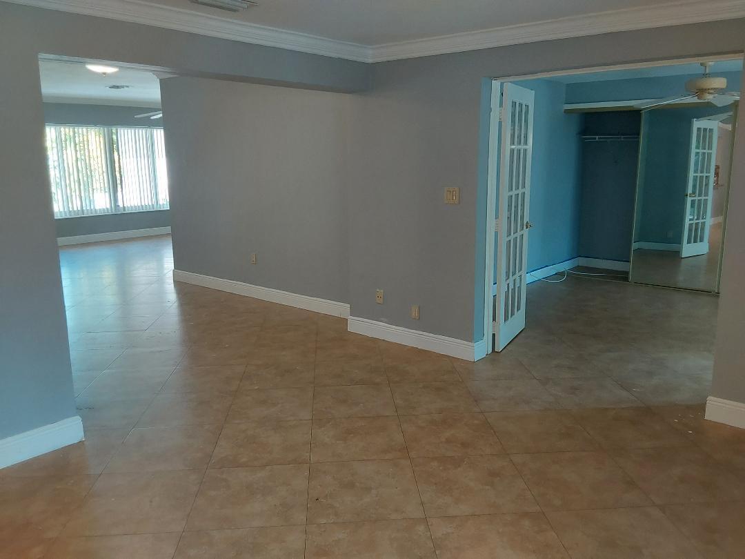 98 Seminole Lane Boca Raton, FL 33487 - Photo 28 of 42 an empty room with closet and windows