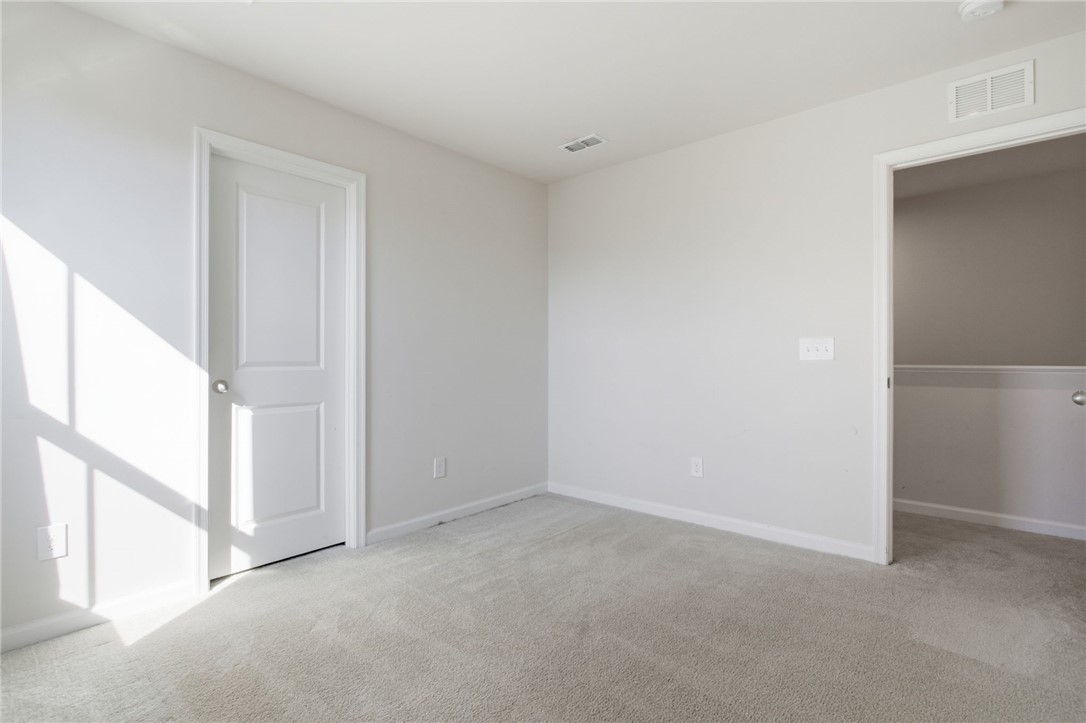 112 Wls Sta Road Seneca, SC 29678 - Photo 28 of 42 Natural light streams across soft plush carpeting in this serene secondary bedroom.