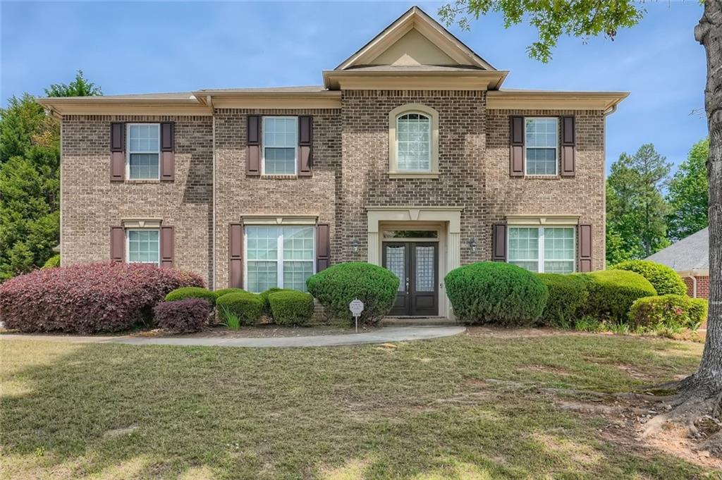 3357 Walnut Ridge South Fulton, GA 30349 - Photo 1 of 1 a front view of a house with garden