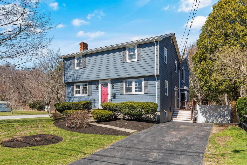 80 Bridge Street Lexington, MA 02421 - Photo 2 of 37 a front view of a house with garden