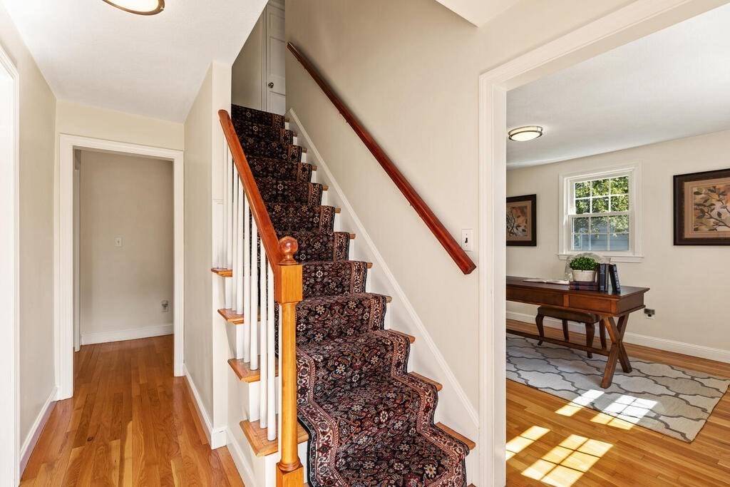 80 Bridge Street Lexington, MA 02421 - Photo 4 of 37 a view of a livingroom with wooden floor and stairs