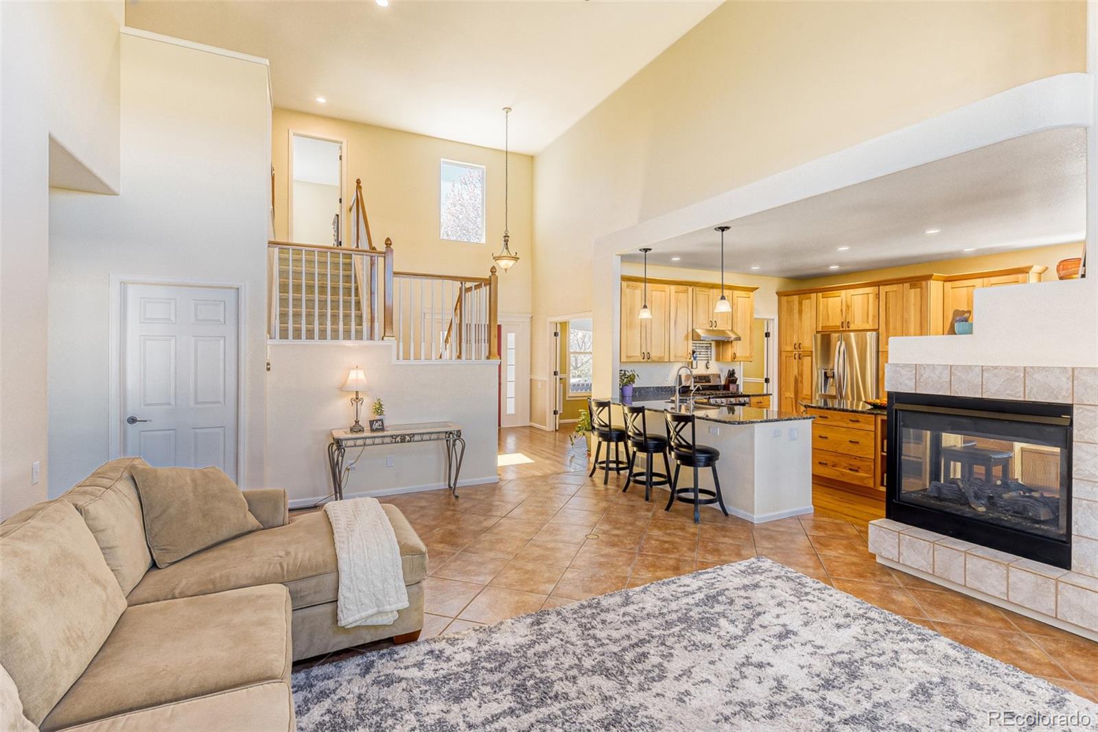 3897 Mallard Lane Highlands Ranch, CO 80126 - Photo 13 of 50 a living room with furniture and a fireplace