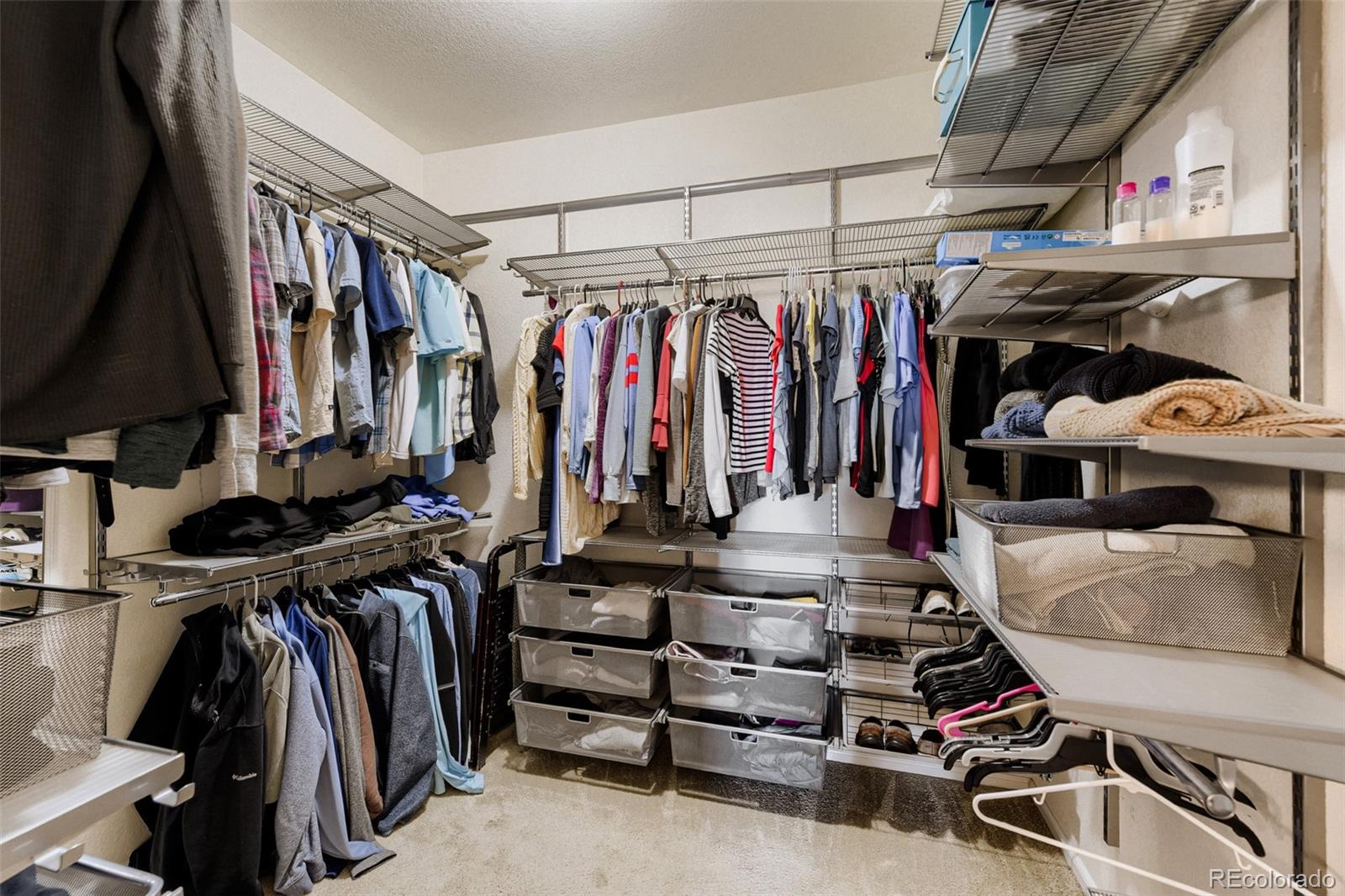 3897 Mallard Lane Highlands Ranch, CO 80126 - Photo 20 of 50 a view of walk in closet with clothes and shoes