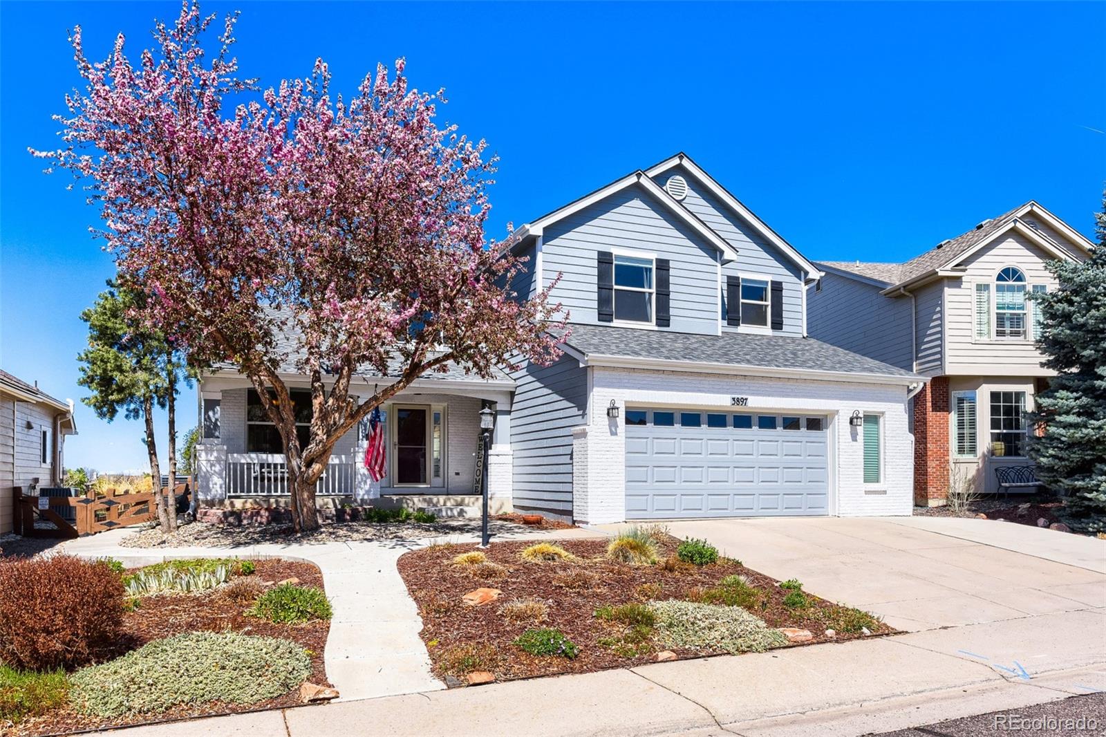 3897 Mallard Lane Highlands Ranch, CO 80126 - Photo 2 of 50 a front view of a house with a yard