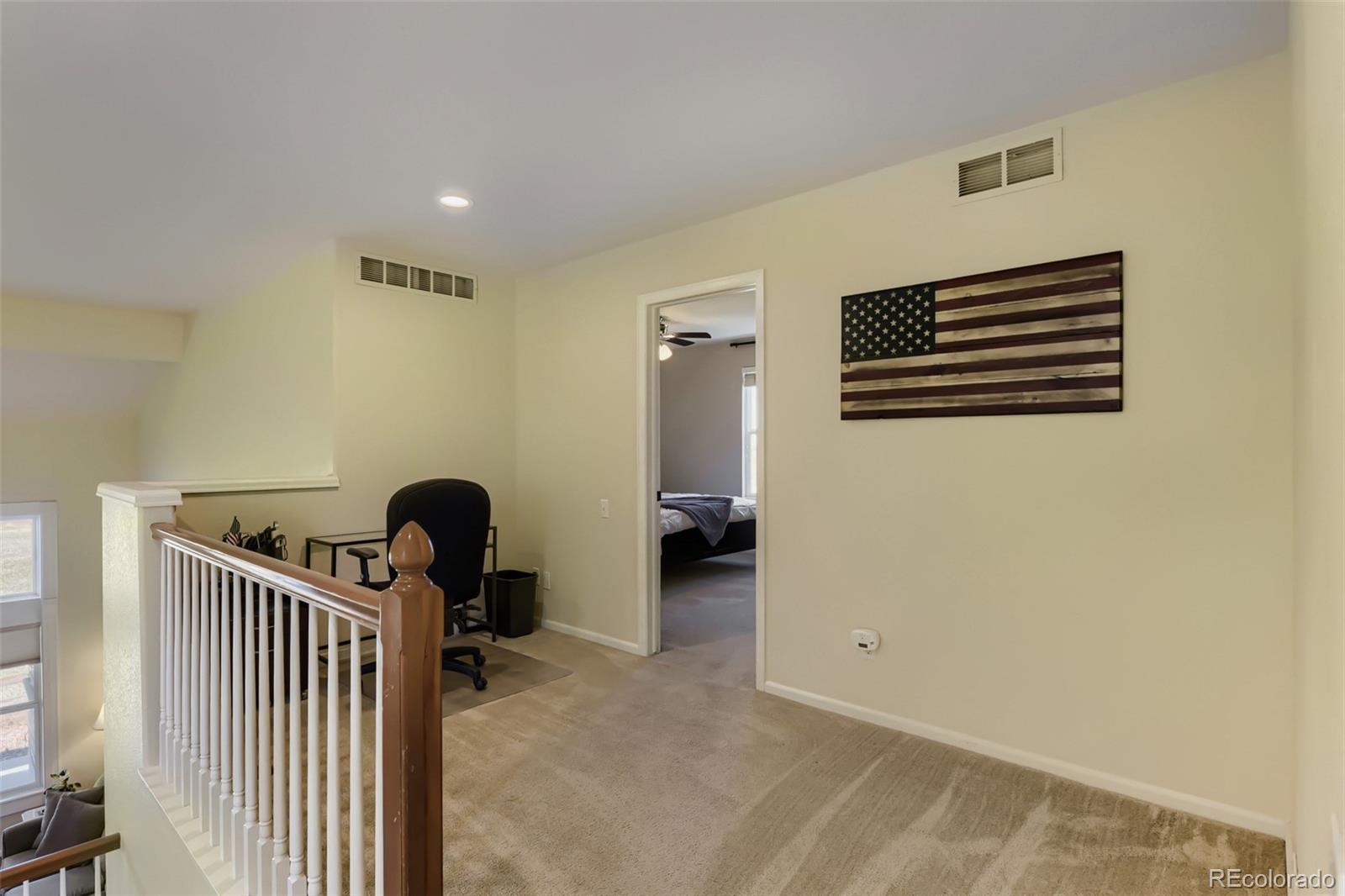 3897 Mallard Lane Highlands Ranch, CO 80126 - Photo 23 of 50 a view of a livingroom with a staircase
