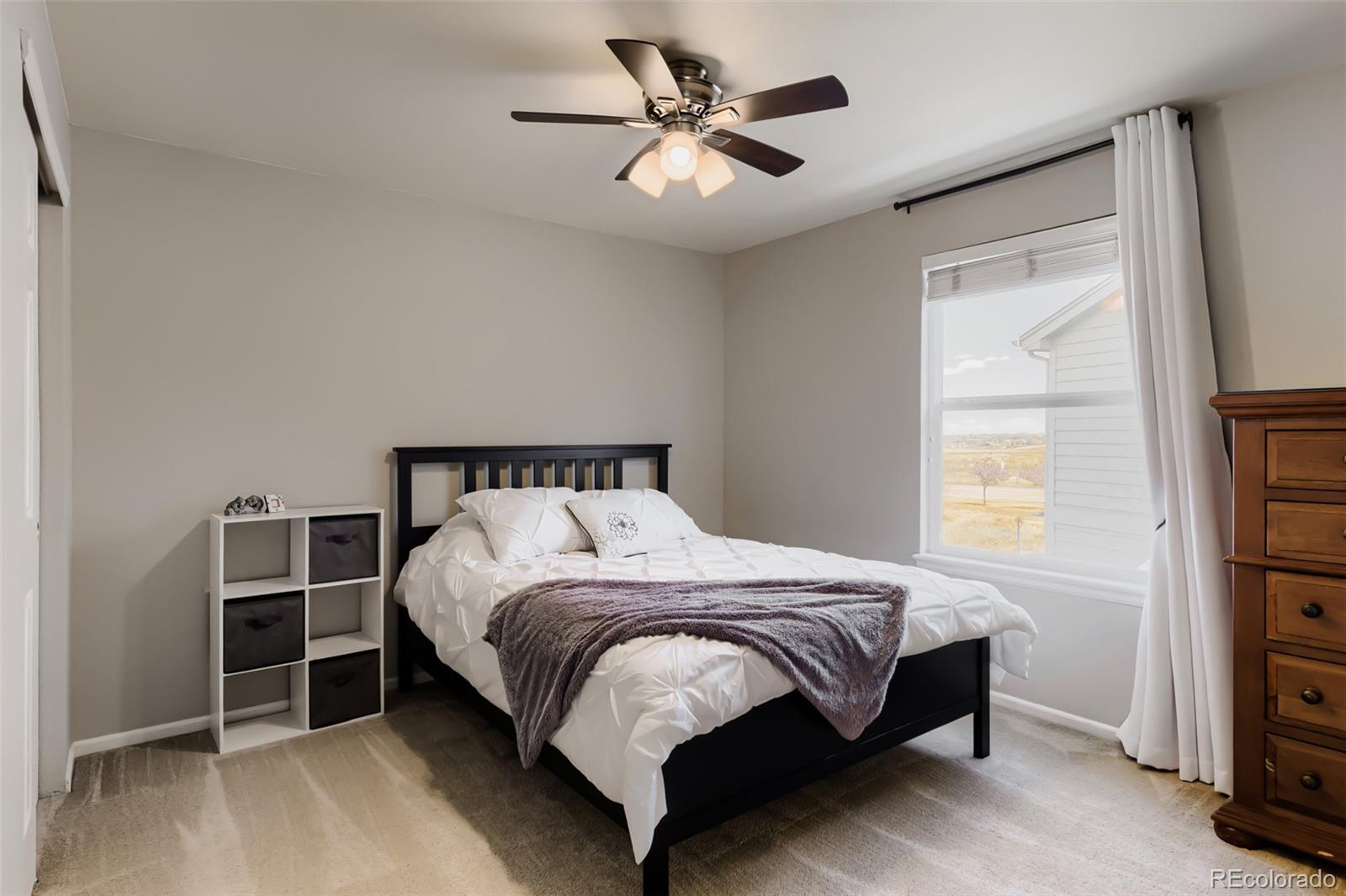 3897 Mallard Lane Highlands Ranch, CO 80126 - Photo 24 of 50 a bedroom with a bed and a window