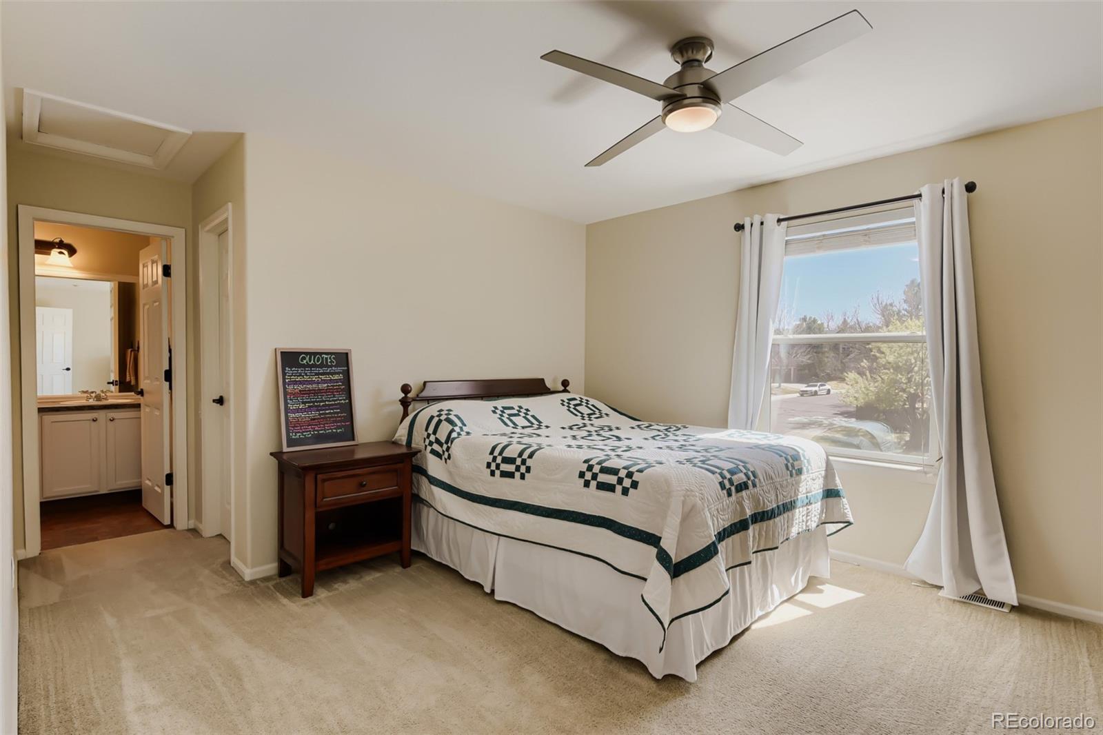 3897 Mallard Lane Highlands Ranch, CO 80126 - Photo 27 of 50 a bed sitting in a spacious bedroom next to a window