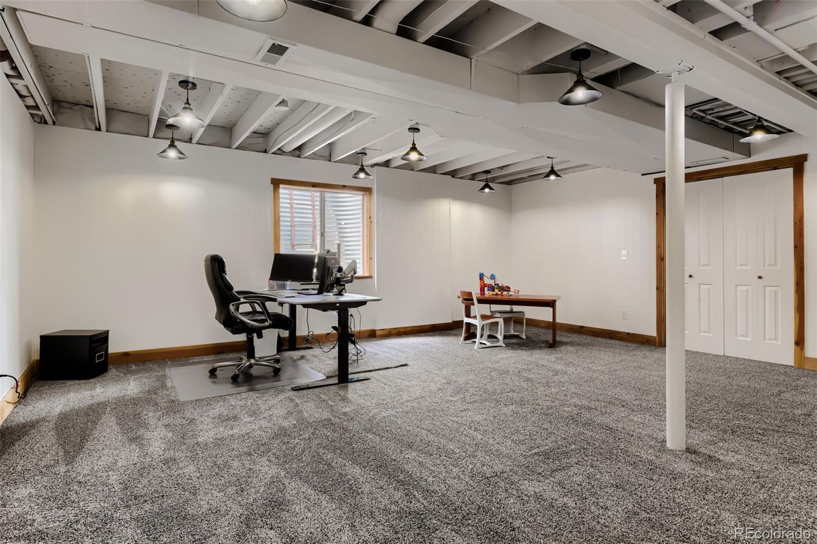 3897 Mallard Lane Highlands Ranch, CO 80126 - Photo 28 of 50 a view of a room with gym equipment