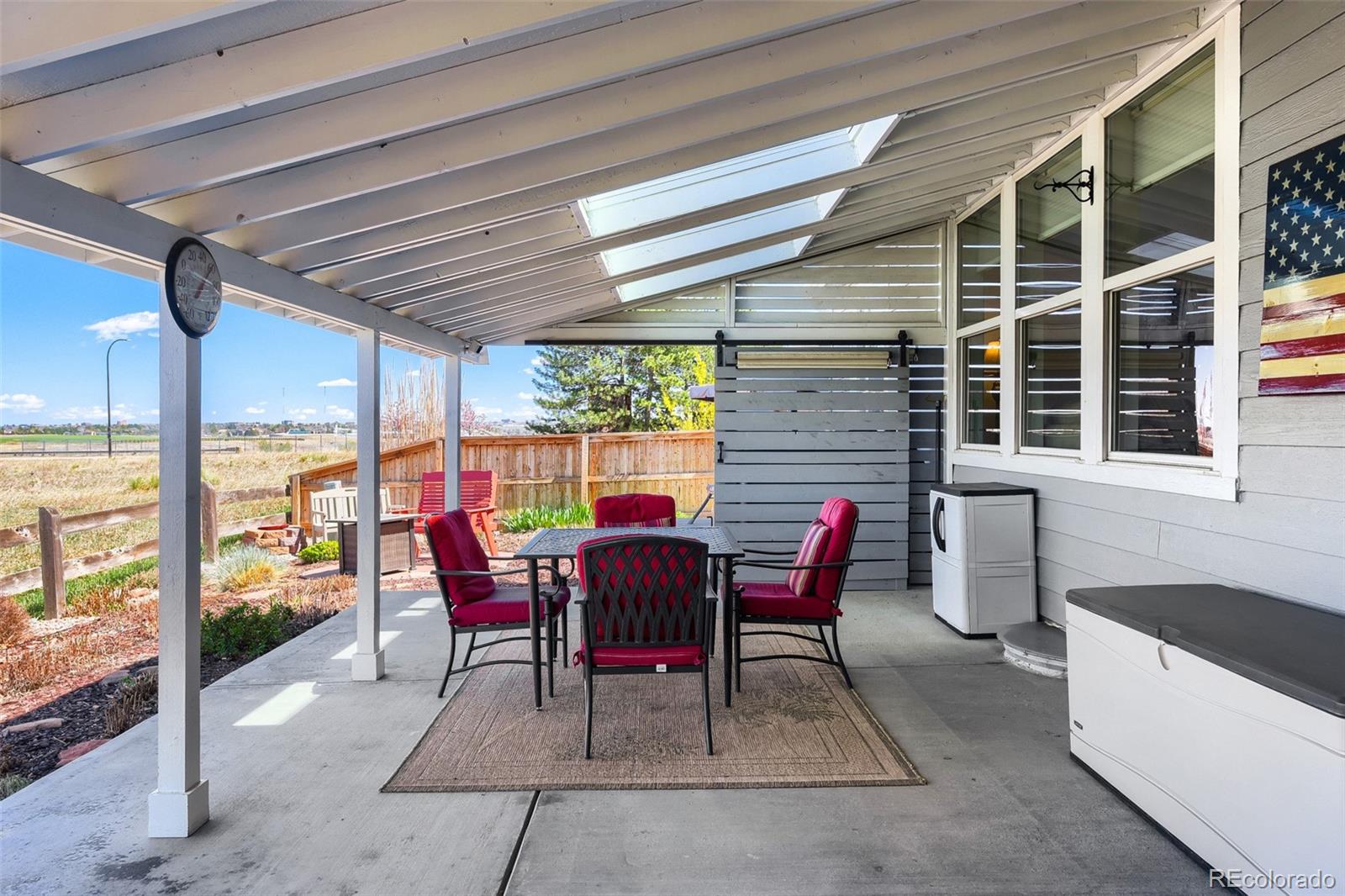 3897 Mallard Lane Highlands Ranch, CO 80126 - Photo 31 of 50 a view of a sitting area with furniture and wooden floor