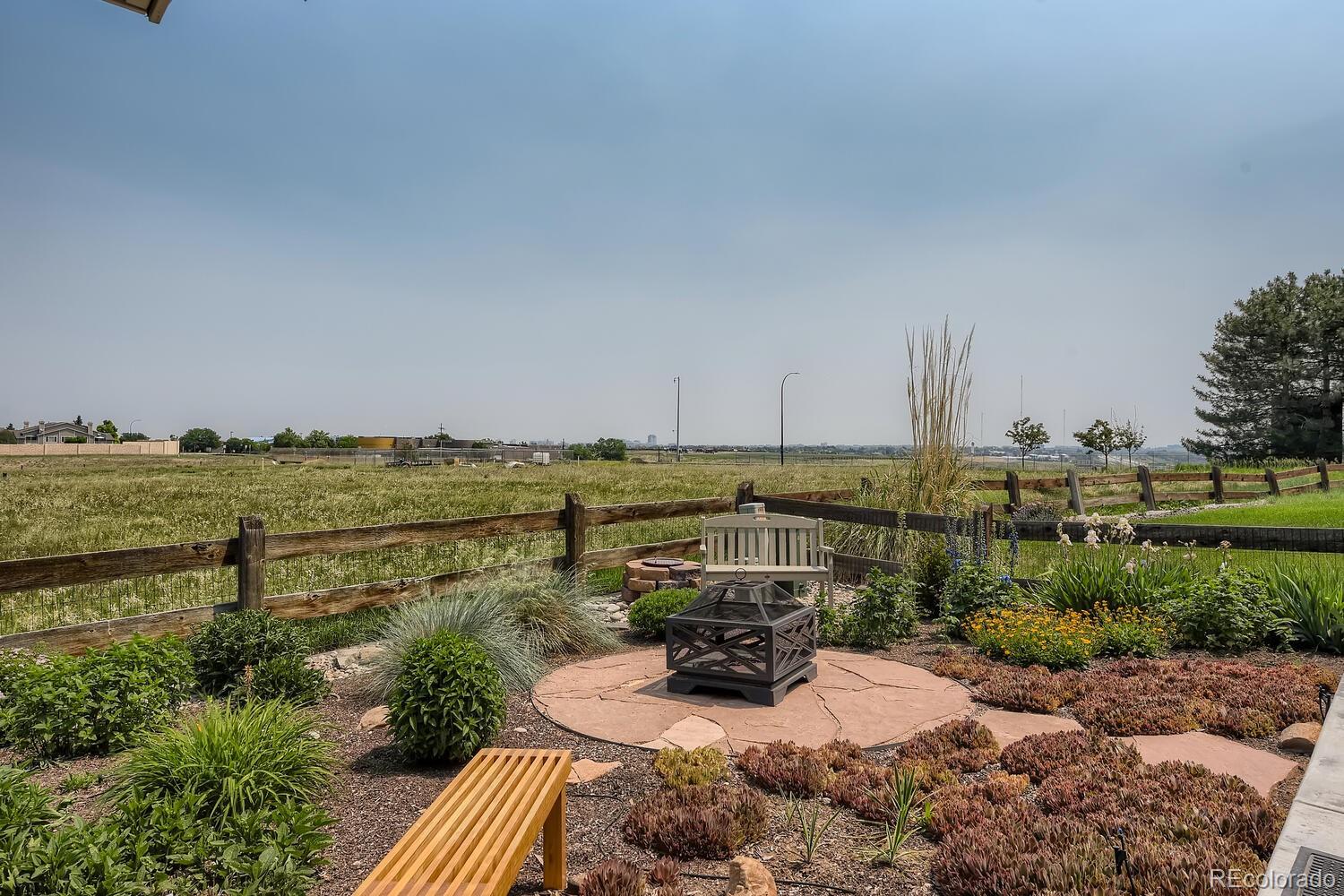 3897 Mallard Lane Highlands Ranch, CO 80126 - Photo 37 of 50 a view of a terrace with a bench