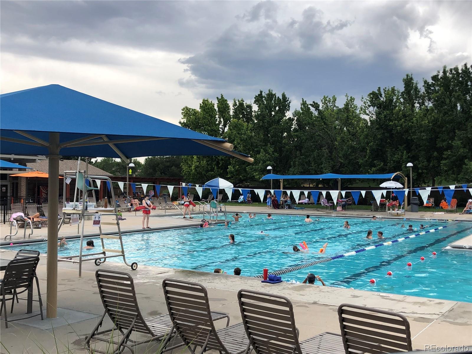 3897 Mallard Lane Highlands Ranch, CO 80126 - Photo 49 of 50 a view of a table and chairs under an umbrella