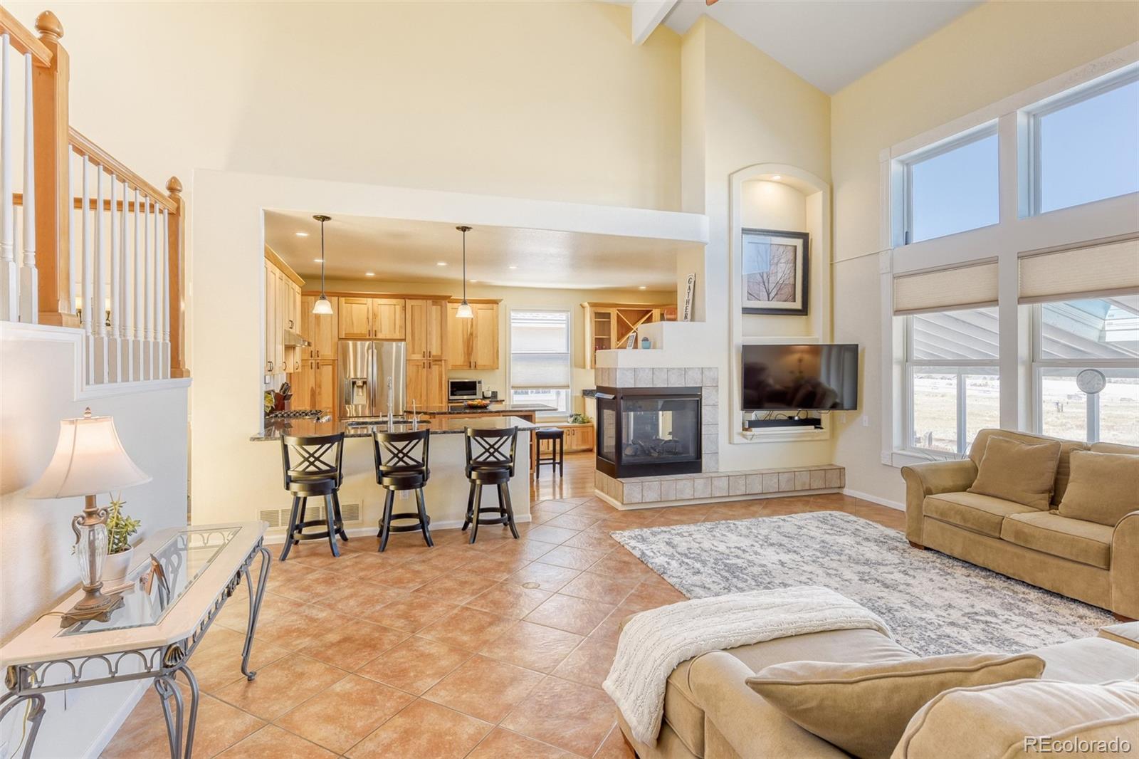 3897 Mallard Lane Highlands Ranch, CO 80126 - Photo 5 of 50 a living room with furniture kitchen view and a large window