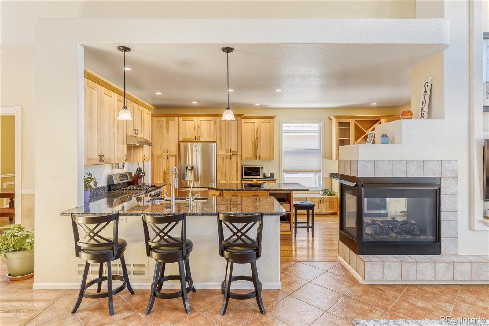 3897 Mallard Lane Highlands Ranch, CO 80126 - Photo 6 of 50 a open kitchen with a table and chairs