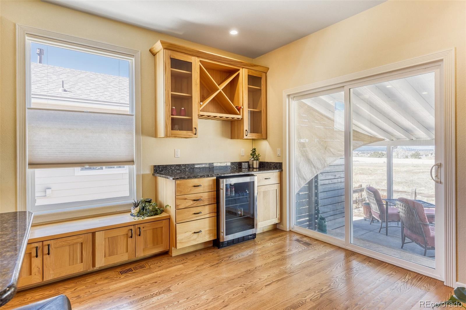 3897 Mallard Lane Highlands Ranch, CO 80126 - Photo 9 of 50 a view of an empty room with a kitchen view and a window