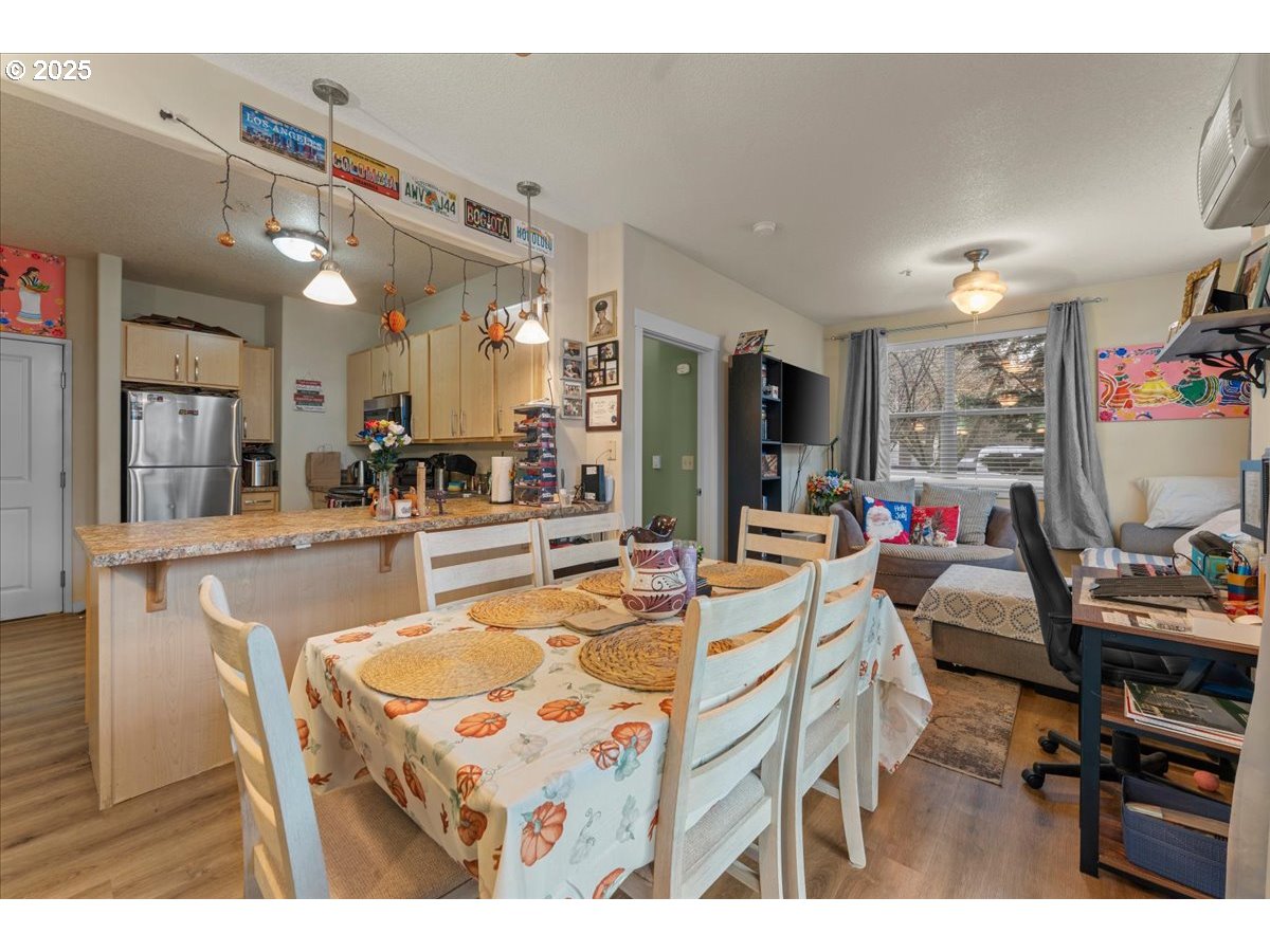 400 Northeast 100th Avenue, Unit 101 Portland, OR 97220 - Photo 11 of 22 a view of a dining area with furniture and a kitchen