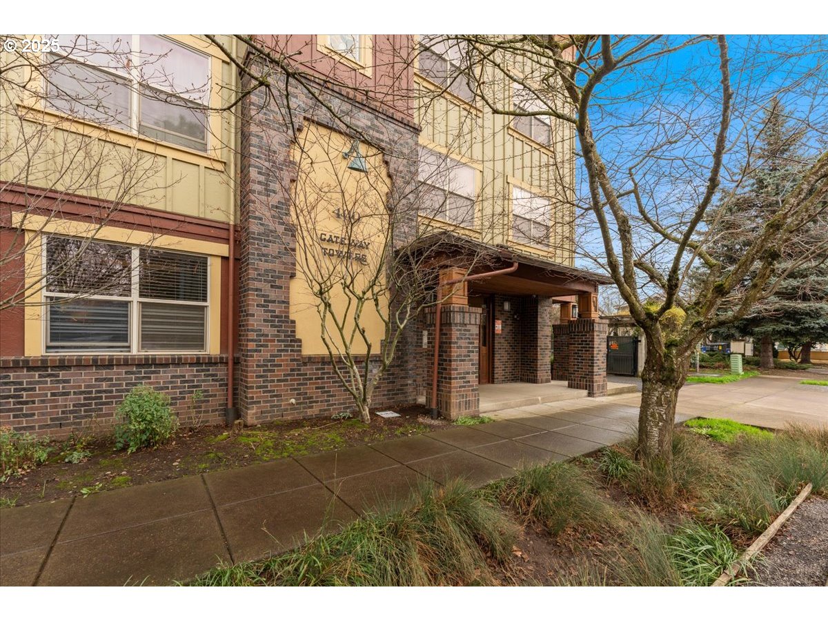400 Northeast 100th Avenue, Unit 101 Portland, OR 97220 - Photo 4 of 22 a front view of a house with a yard