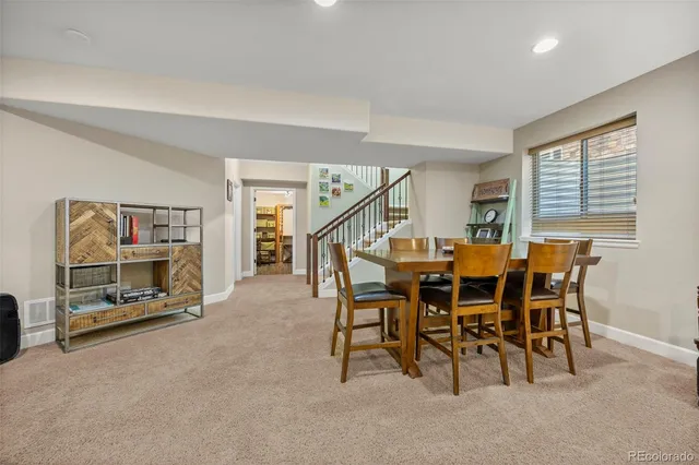 a dining room with furniture and a fireplace