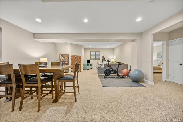 a living room with furniture a window and a dining table