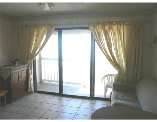 3938 Surfside Boulevard, Unit 3332 Corpus Christi, TX 78402 - Photo 2 of 8 a view of entryway with furniture and a window