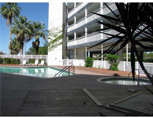 3938 Surfside Boulevard, Unit 3332 Corpus Christi, TX 78402 - Photo 6 of 8 a view of a swimming pool with a patio