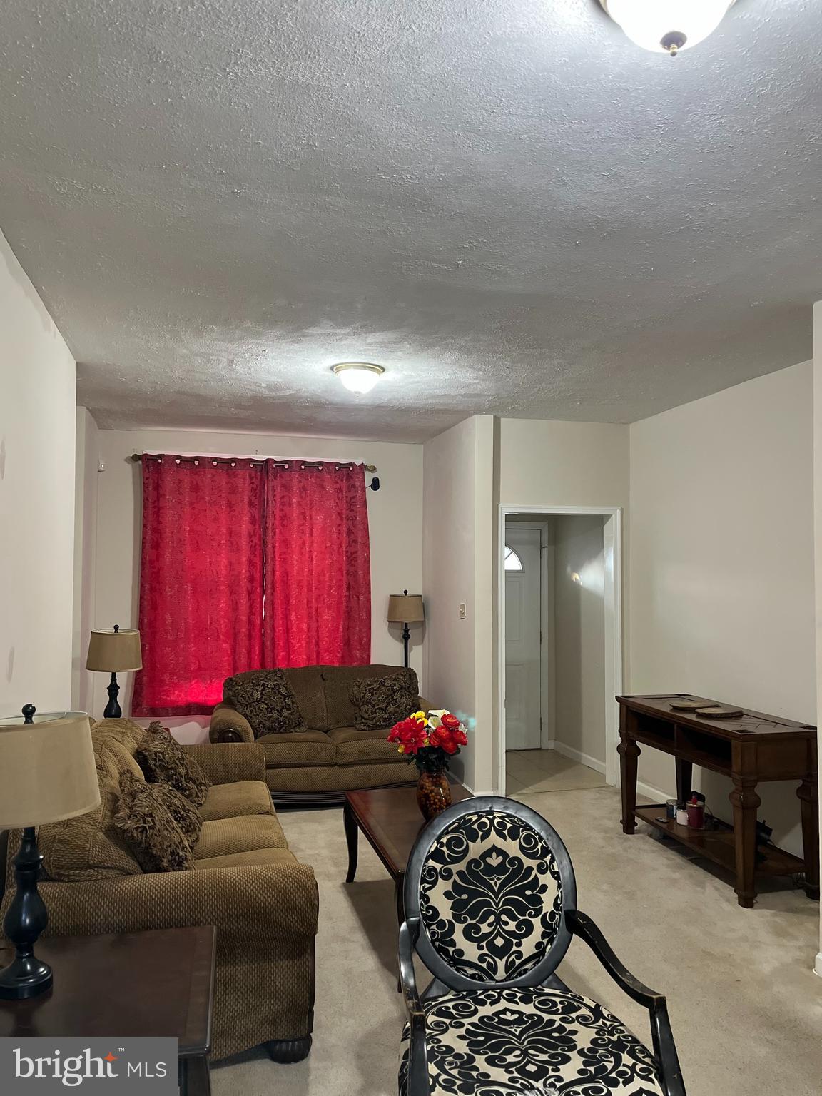 833 North Front Street Reading, PA 19601 - Photo 4 of 24 a living room with furniture and a window
