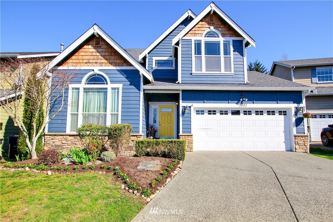3827 160th Place Southeast Bothell, WA 98012 - Photo 1 of 40 a front view of a house with garden