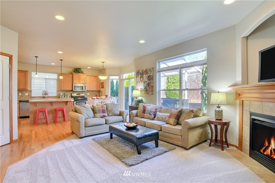 3827 160th Place Southeast Bothell, WA 98012 - Photo 21 of 40 a living room with fireplace furniture and a fireplace