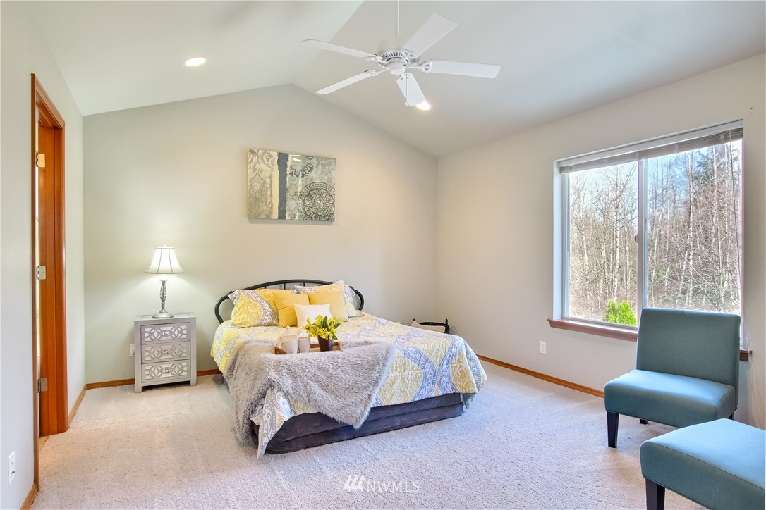 3827 160th Place Southeast Bothell, WA 98012 - Photo 23 of 40 a bedroom with a bed couch and window