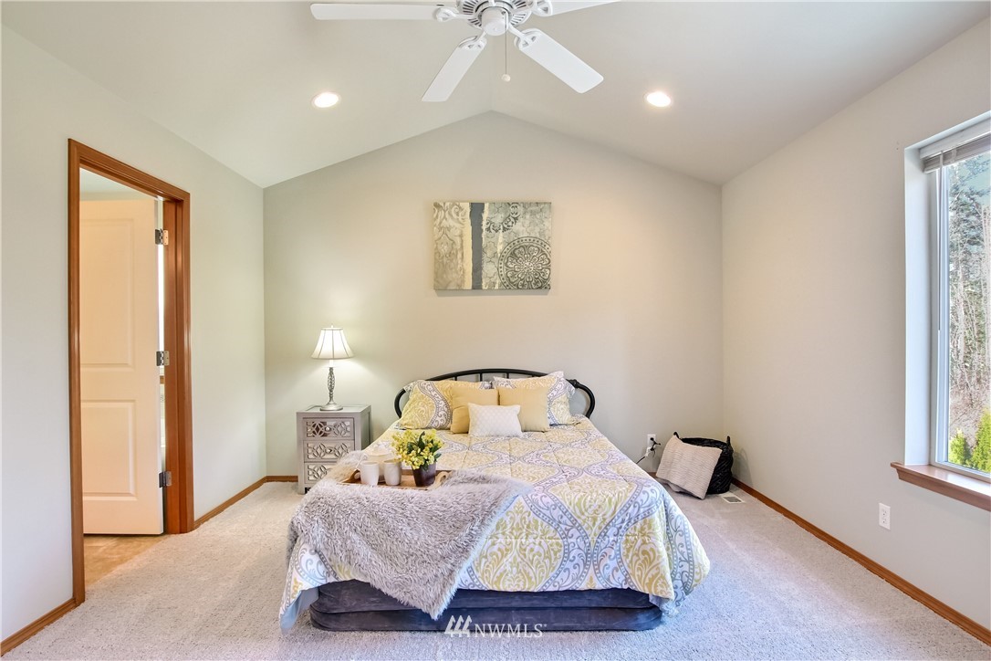 3827 160th Place Southeast Bothell, WA 98012 - Photo 24 of 40 a bedroom with a bed and a window