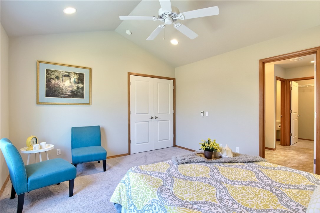 3827 160th Place Southeast Bothell, WA 98012 - Photo 25 of 40 a bedroom with a bed and a couch